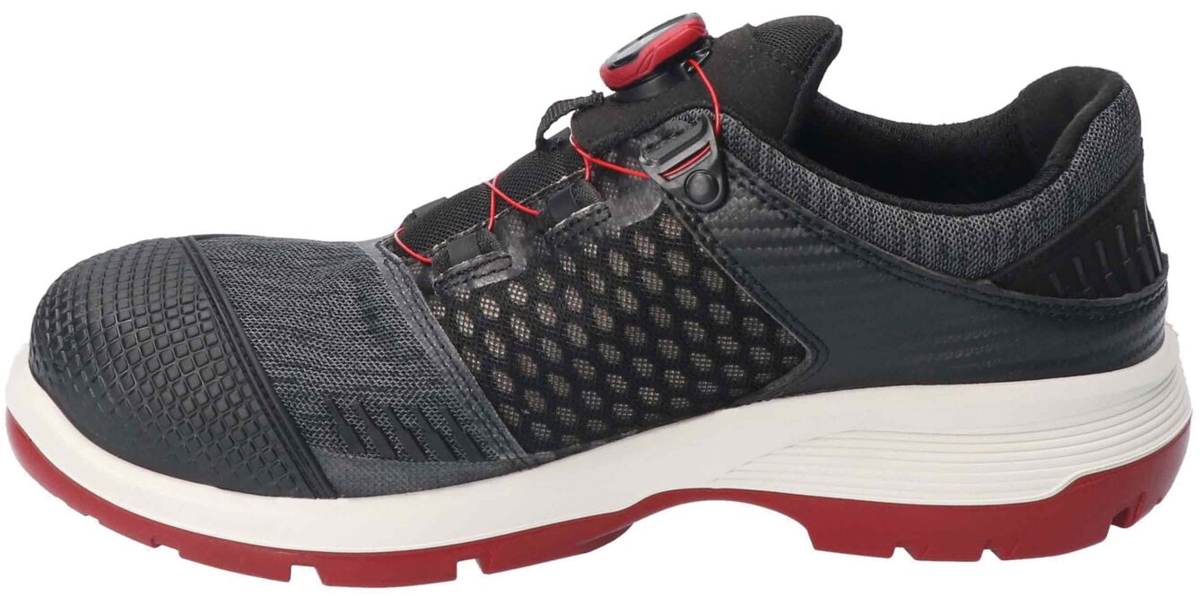 The shoe is sporty and modern, in black with gray and red accents. It has a breathable surface, a non-slip sole, and a convenient toggle lacing closure.