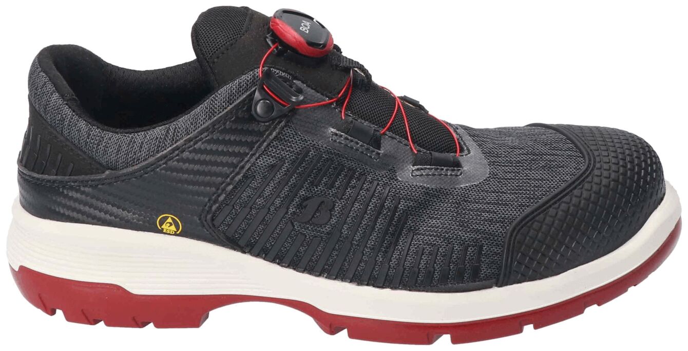 The shoe is black with a textured upper and a red, non-slip sole. It features a quick lacing system with a red drawstring and a gray tab.