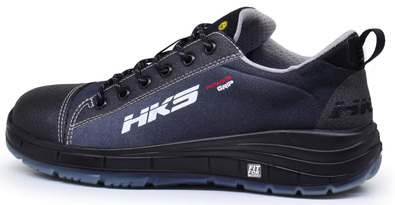 The shoe is black with gray and red accents. It has a low profile, thick sole, and laces. On the side it says "HK3" and "Power Grip". Ideal for comfort and support.