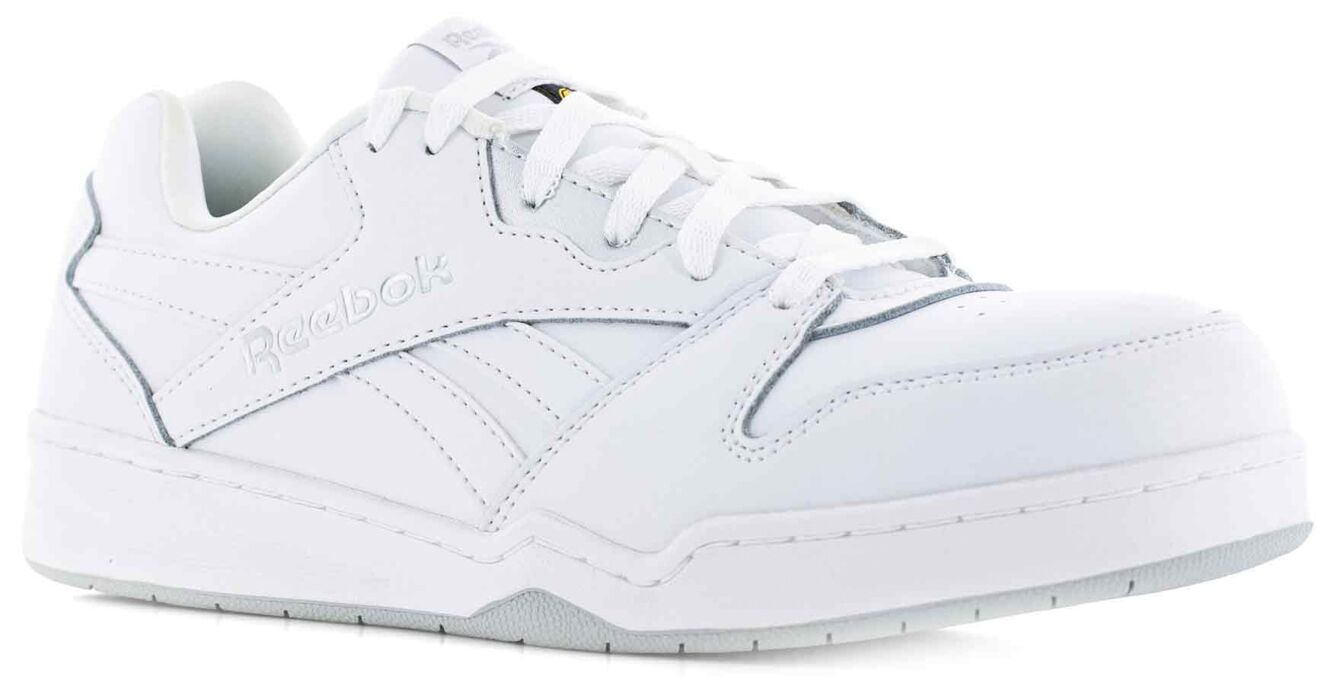 The image shows a white Reebok sneaker. It has a smooth, shiny surface, round laces, and a sporty design with side lines and a thick rubber sole profile.