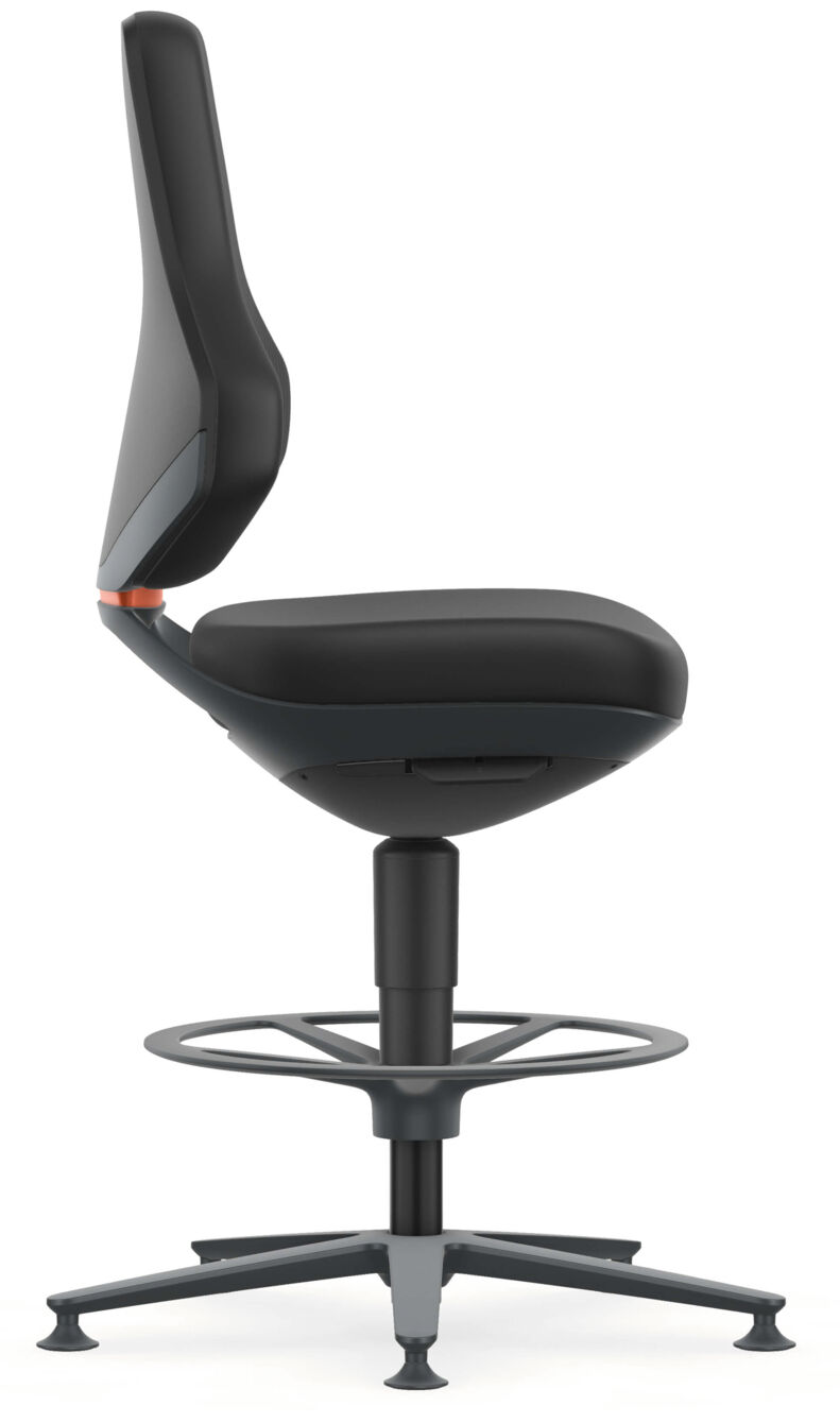 In the picture, there is a black office chair in profile. It features a padded seat, a high backrest, and a round footrest. The base is stable and has five casters.