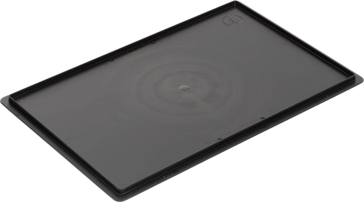 The image displays a rectangular, black tray or holder. It features a smooth surface with a central pattern and slight elevations along the edges.