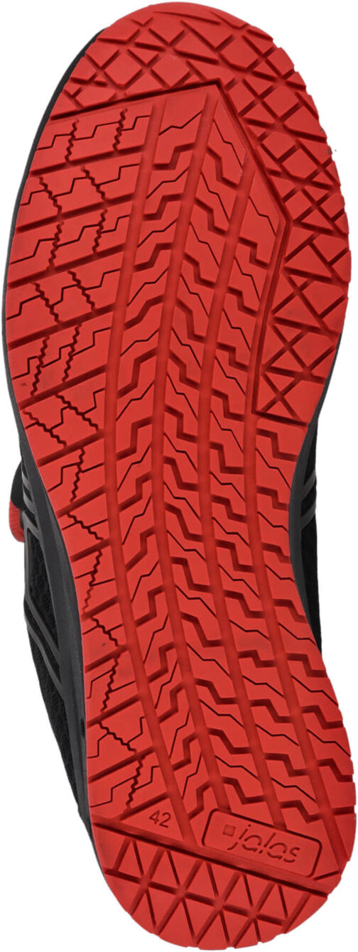 The image shows the sole of a shoe. The sole is black with a distinctive red tread. The pattern consists of various lines and grooves that provide good traction.