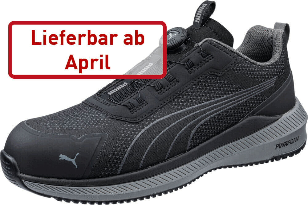 The image shows a black sports shoe with a modern design. It has a textured surface and is equipped with a mesh upper material. On the side is the Puma logo. In red text it says "Available from April".