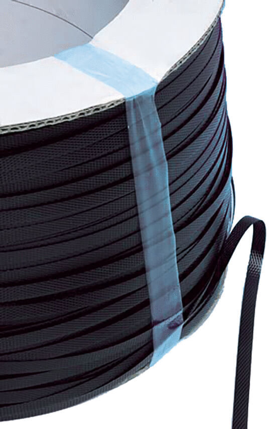 The image shows a roll with black, thin ribbon wound in a spiral. It is neatly and evenly arranged on the roll. At the edge, one end of the ribbon hangs down.