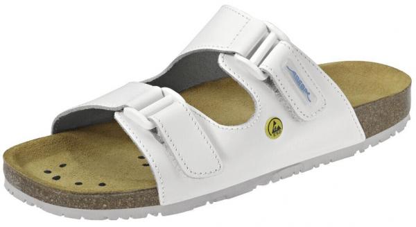 The shoe is a white sandal with wide straps and two practical Velcro fastenings. The sole is made of brown leather and features an ergonomic design for comfort.