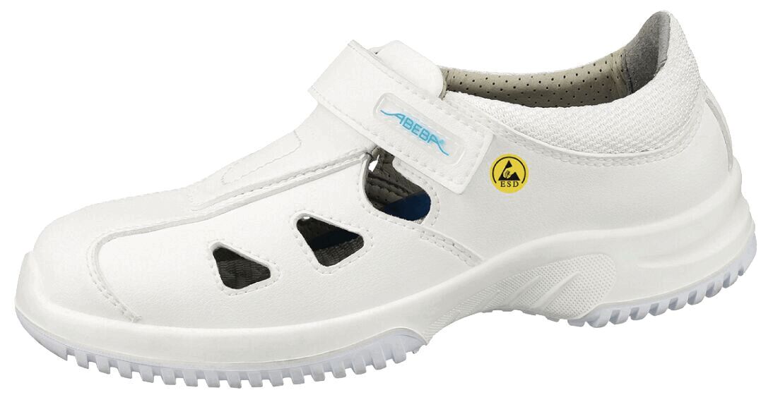 The shoe is white and features a sporty, open design with side cutouts. It has a wide Velcro strap and a non-slip sole, ideal for everyday and leisure use.