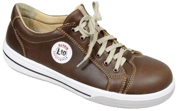 The shoe is a brown leather sneaker with a white sole. It has round laces in light beige and a small round logo on the outside.